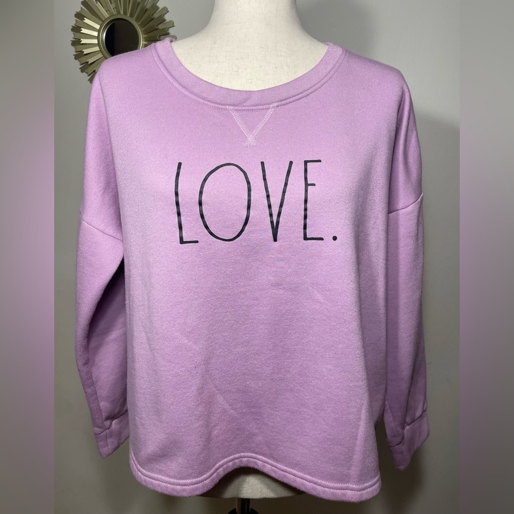 Rae Dunn “LOVE” sweater.  The color is purple and the Size is Medium.